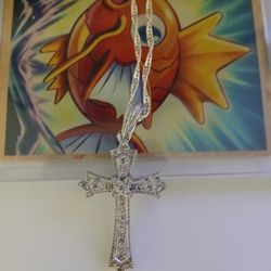 Diamond Silver Cross And A Emerald Diamond Necklace 