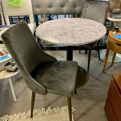 NEW Faux Marble bistro table And 2 Gray velvet chairs. Table is 32” across. —-Visit EN Miller Antique Mall in Verona. 