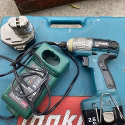 Single Milwaukee Drill With Spare Battery And Charging Dock