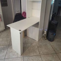 white cabinet with fold out table