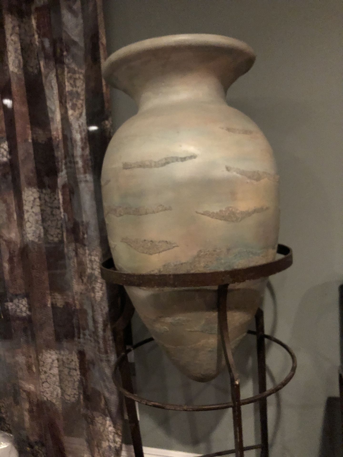 Floor vases on wrought iron stands