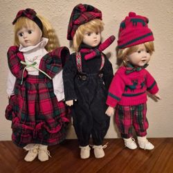 Three (3) Vintage Porcelain Holiday Dolls