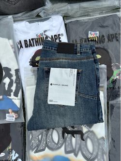 Purple jeans size 34, brand new with bag.