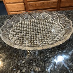Beautiful Glass oval shaped serving tray with scalloped design around the top edging.  Size 12 inches wide and 9 1/2 inches long.  Color clear.  Nice 