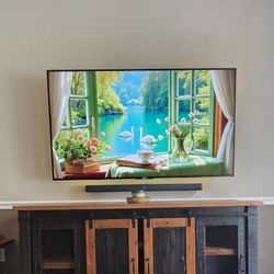 Rustic Farmhouse TV Console with Sliding Barn Doors from Rooms To Go