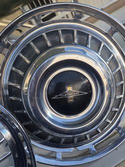 vintage Chevrolet Corvair Monza hubcap, likely from a 1962 or 1963 model, featuring a 13-inch diameter.