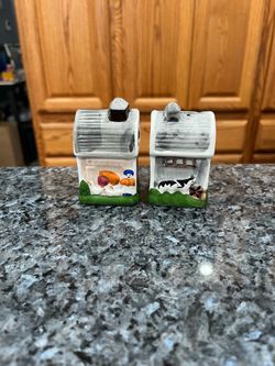 Vintage Barn pair of salt and pepper shakers.  Preowned.  Brand WCL with stickers on the bottom.