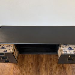 Black Desk Or Entertainment Center With Cowboy Wallpaper Drawers
