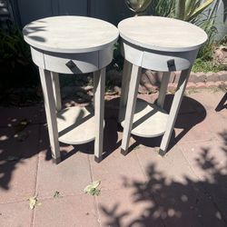 2 round side table with a single drawer and a lower display shelf