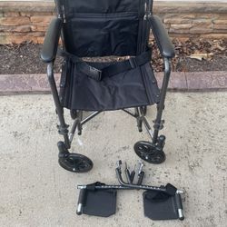 New McKesson Wheelchair With Footrests In Awesome Condition and Rolls Easily Anywhere.
