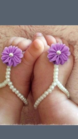 Purple and pink pearl footwear for a baby!