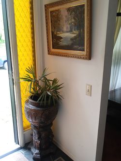 2 piece jardinaire plant stand with ancient people on it