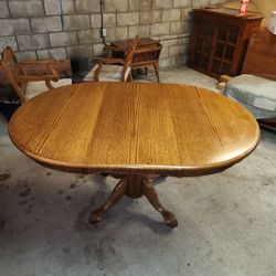 OAK TABLE with 4 ROLLING CHAIRS