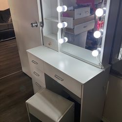 White vanity with chair