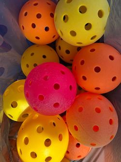 A dozen pickle balls