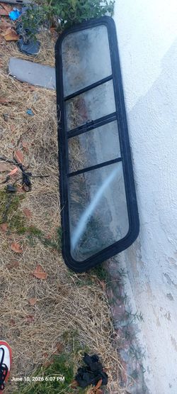 1(contact info removed) Ford Ranger regular cabrear sliding back glass window with a black frame.