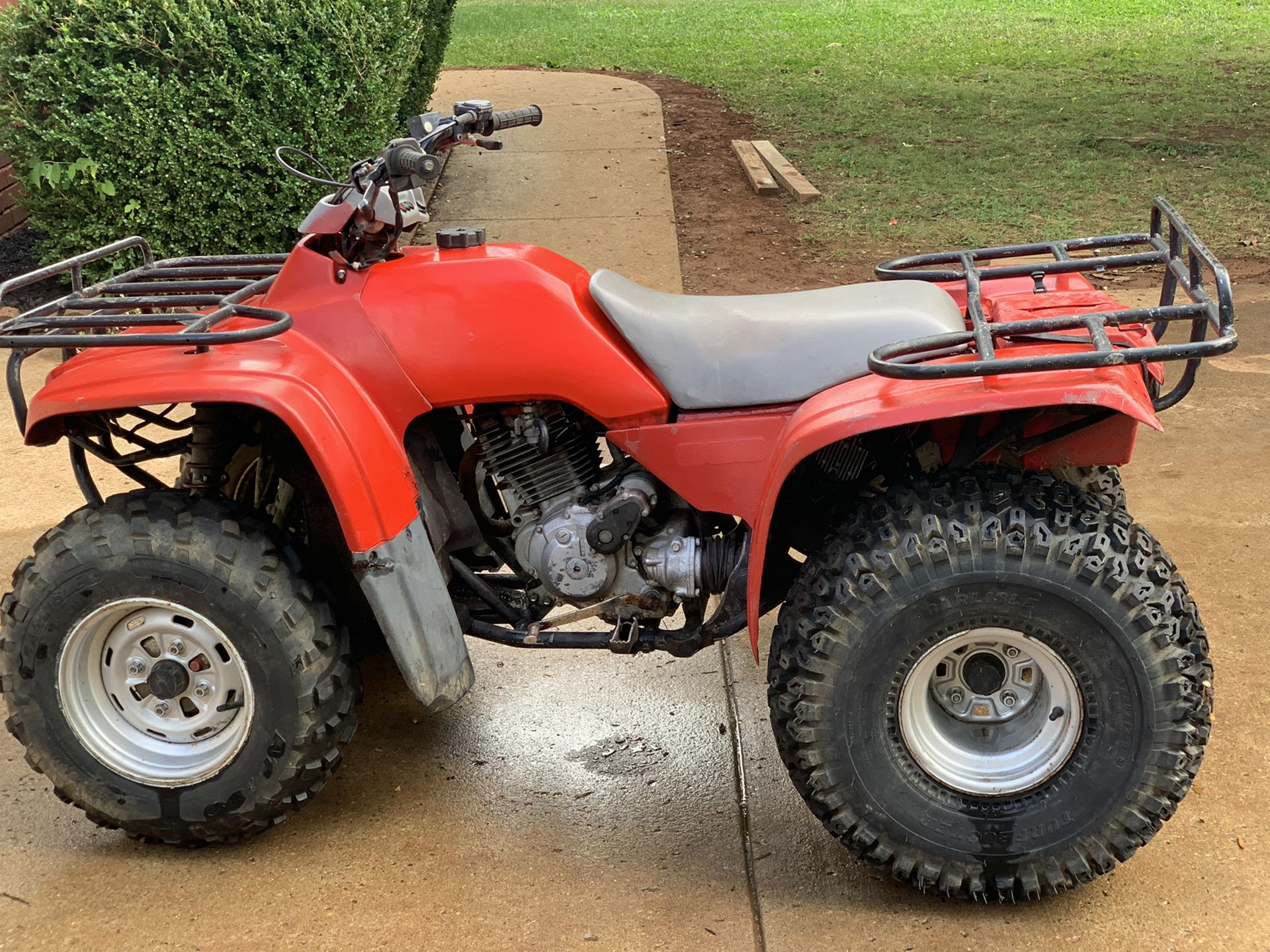 Honda red foul wheeler ATV 4x4