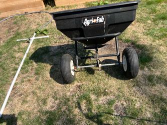 Agri-fab fertilizer spreader for pulling behind mower