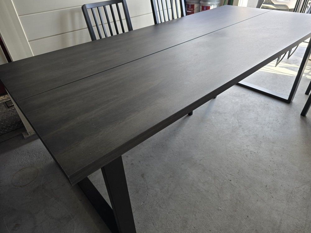 IKEA Very nice and solid dinner table with 6 chairs in good condition.