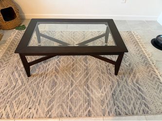 Dark wood glass top coffee table