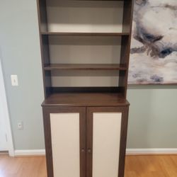 Fabric backed cabinet with doors 