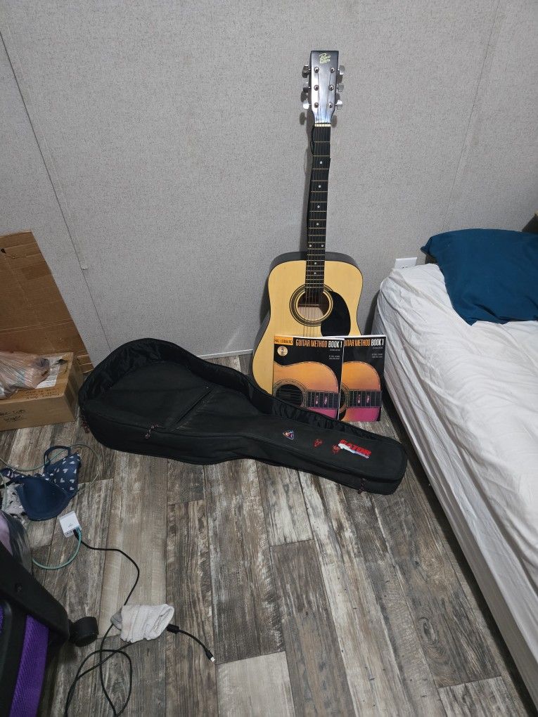Rouge Acoustic Guitar With Books, Picks And Tuner