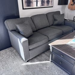 Gray Couch, Chair, Area Rugs