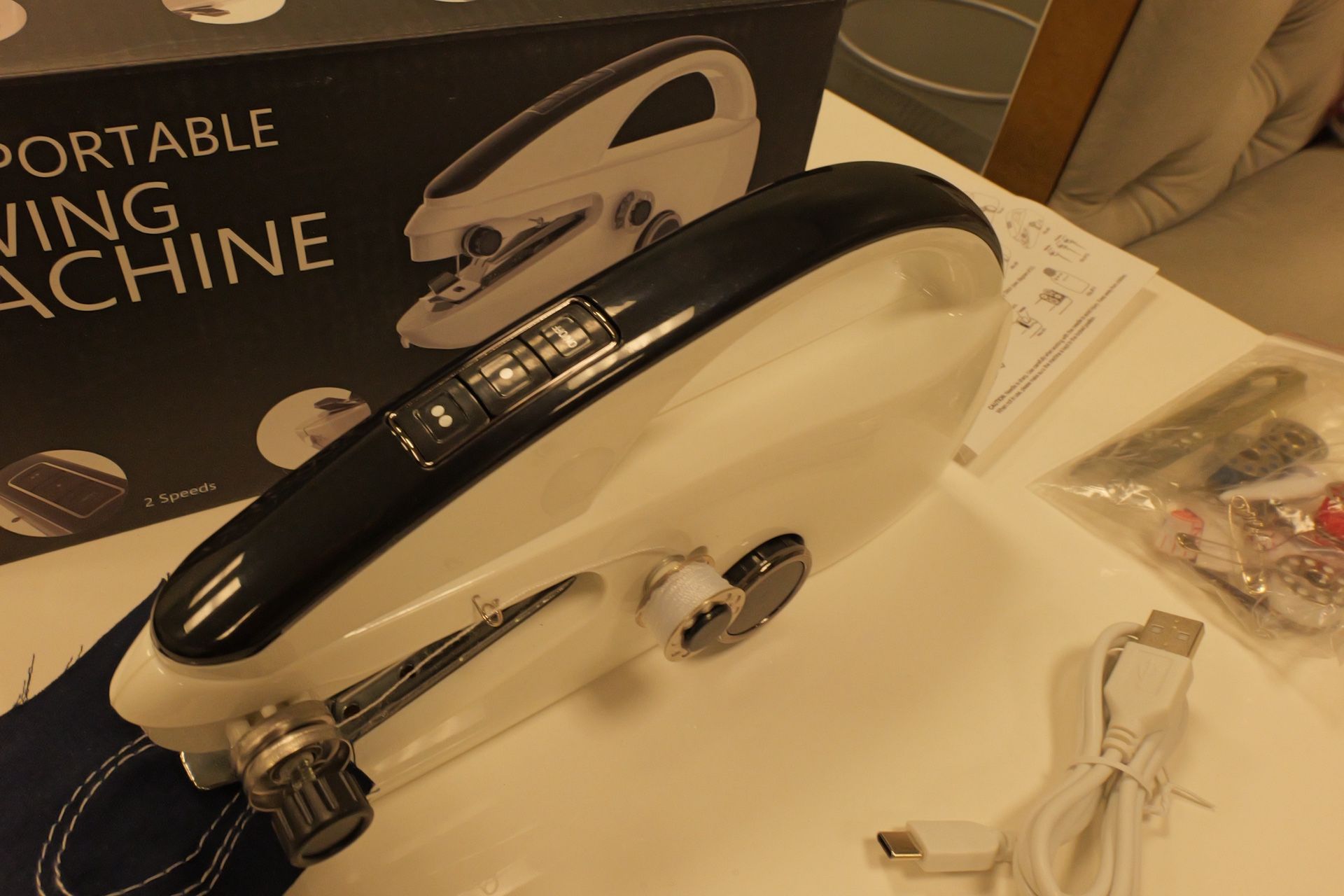 Hand sewing machine portable with batteries or cord