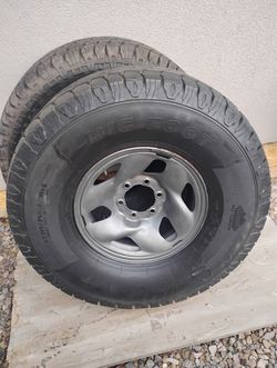 Two black tires /Big foot