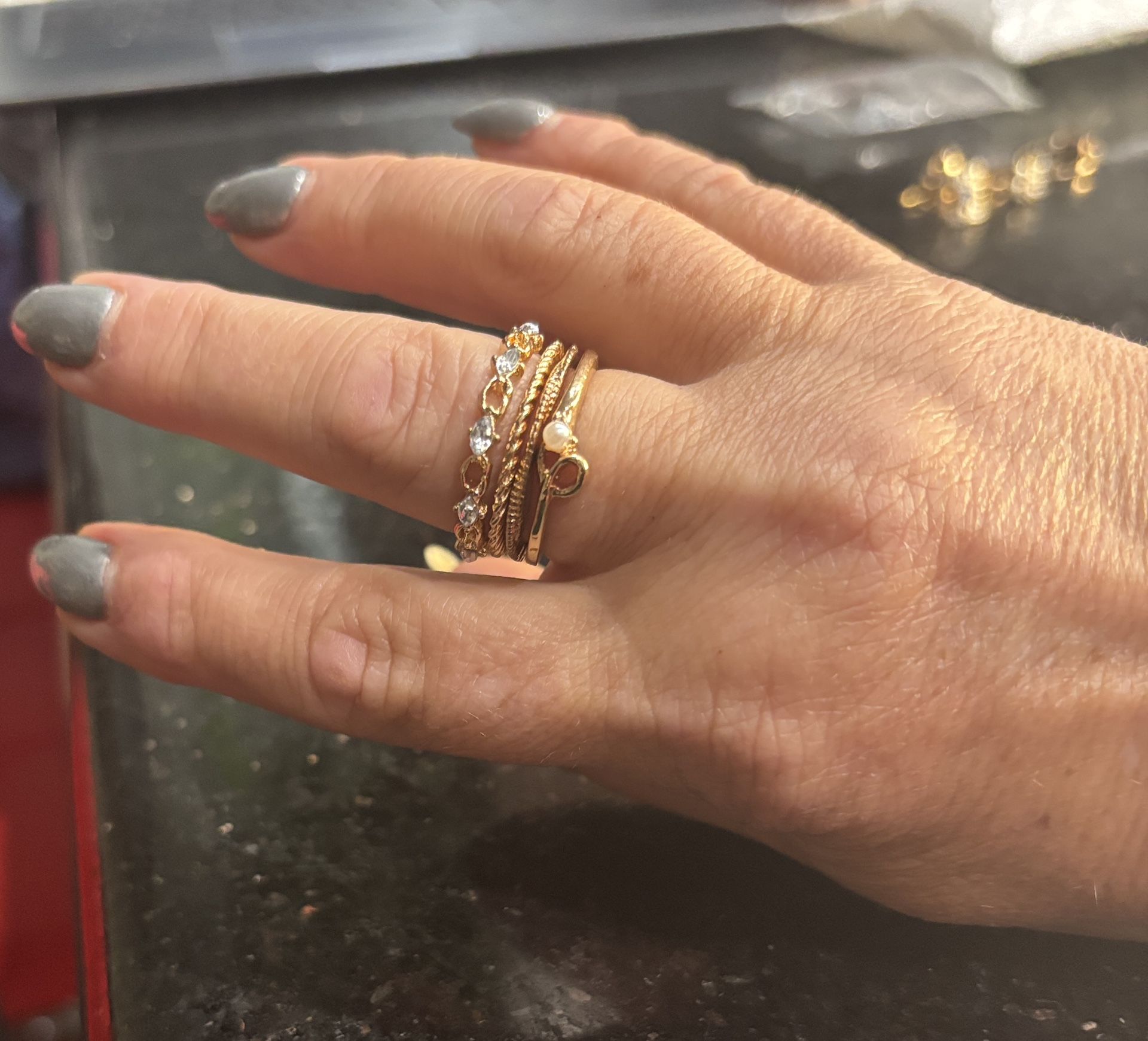 Bundle of 4 gold rings, including a stackable ring and a heart-shaped rings Size 8