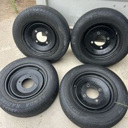 Golf cart rims and tires 14 inch rims and tires. Tire size 175/70R /14  rim bolt pattern 4x156