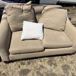 Free used sofa and loveseat. These are expensive couches. They are filled with down feathers.