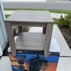 Used End Table Scratched On One Of The Legs