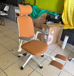 Sunaofe Boss Pro Ergonomic Chair featuring a white frame and brown leather upholstery. Damage on left side