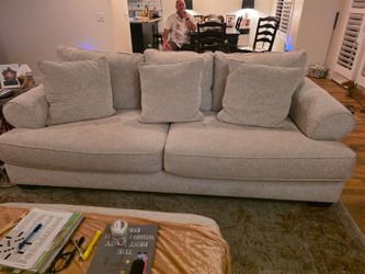 Large Light Gray/Beige Upholstered Sofa with Ottoman with Pillows