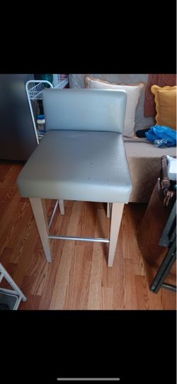 Grey faux leather bar stool with wood legs 2 available $20 each