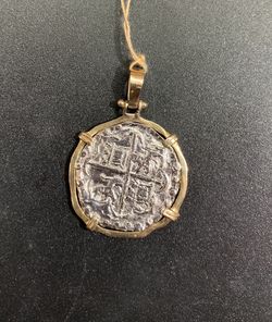 Atocha silver coin pendant in gold bezel