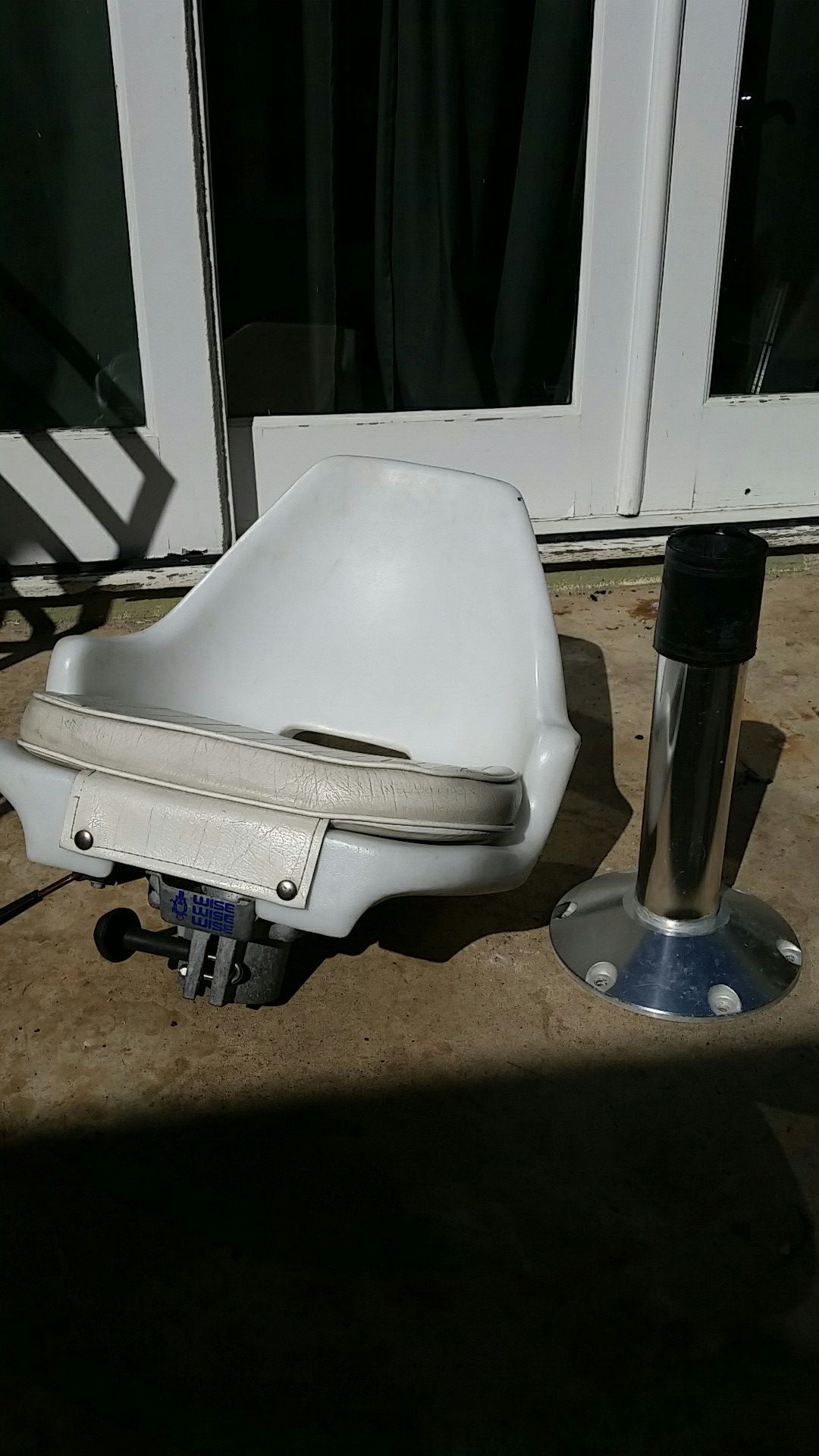 Boat seat , pad , and stainless steel post.