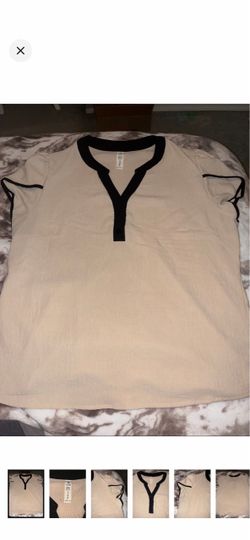 Size large women’s blouse in beige with black trim
