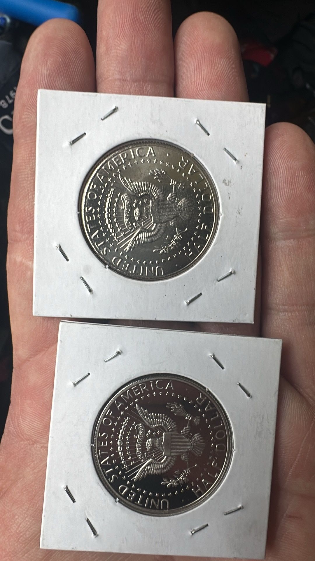 2 half Dollars One Is Finished And The Other Is Not