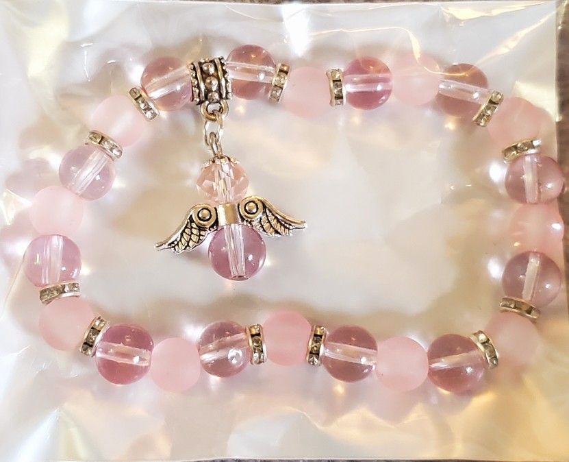 Rose Quartz Beaded Bracelet Features An Angel