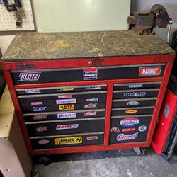 Large rolling toolbox with vise and tools in every drawer