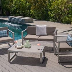 Outdoor patio loveseat with chairs and coffee table