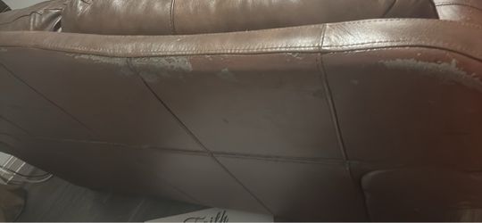 Brown Leather couch and loveseat plus cocktail table