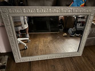 Wall mirror newly painted very nice glossy look not a scratch on mirror asking 55 mirror is  43 inches wide 32 tall need gone