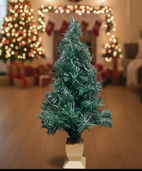Christmas tree, about 33" tall π
Sturdy and set inside a decorative pot.
Features color-changing multicolor lights running along its length β¨
