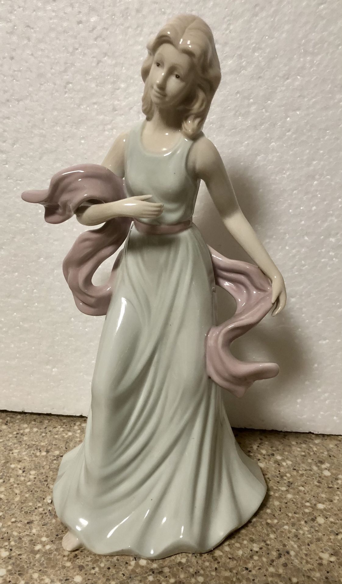 Porcelain Figurine of Young Lady In Green Flowing Dress And Scarf 10” Tall