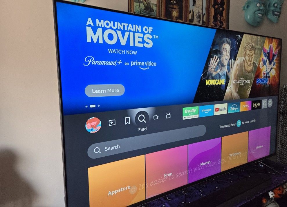 Amazon Fire TV 75" Omni Series, 4K UHD smart TV with Dolby Vision, hands-free with Alexa with a SONY Soundbar.