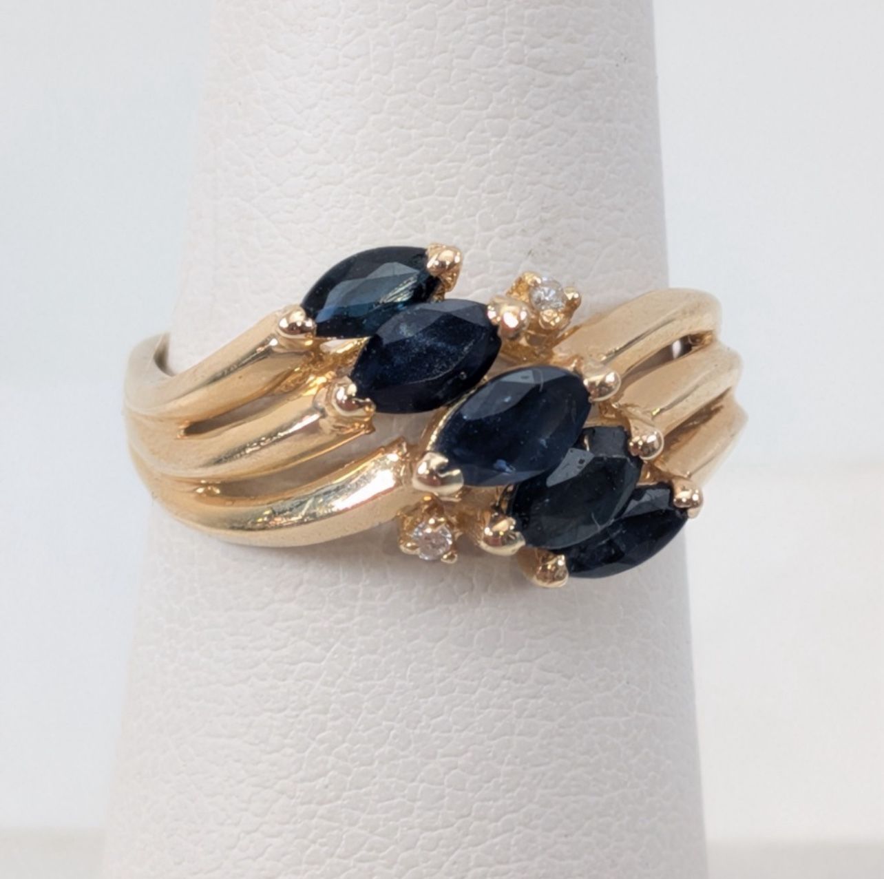 14K Yellow Gold Ring w/ Blue & Clear Stone Accents Elegant 14K yellow gold ring featuring five marquise-cut deep blue stones, beautifully arranged in 