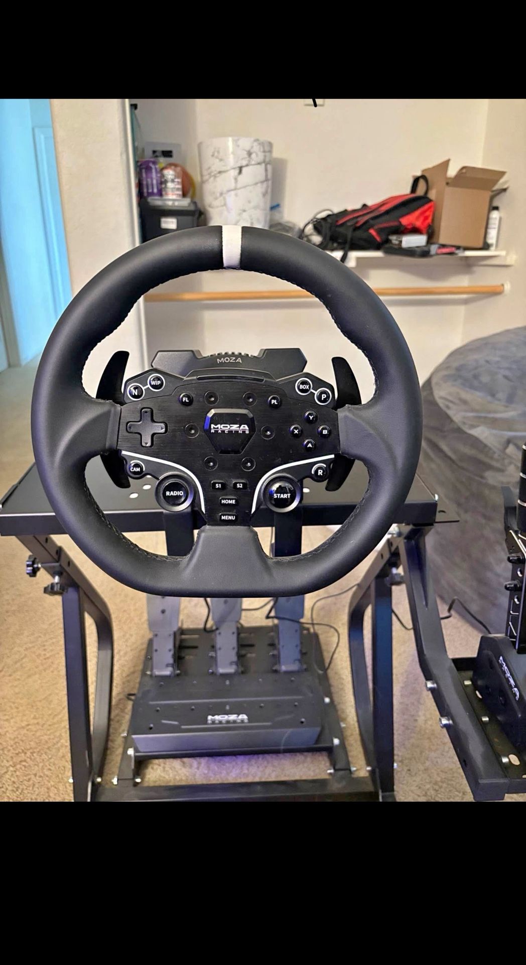 Moza r5 steering, wheel pedals and clutch comes with a sequential shifter and the cockpit seat